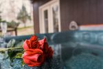 Enjoy a romantic soak in the hot tub with your loved one at Ma Cook Lodge